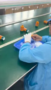 FiHP 600K 6in1 devices being handled at a factory packing workstation